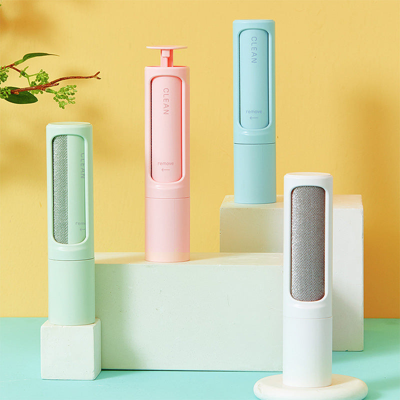 Reusable self-cleaning lint and pet hair remover rollers in blue, green, pink and white.